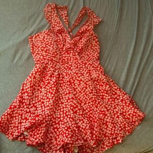 Orange floral romper. Size M Womens.